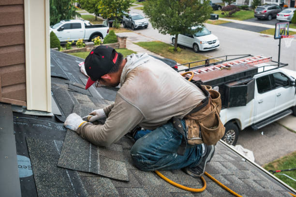 Professional Roofing technician working in Lowell, MA